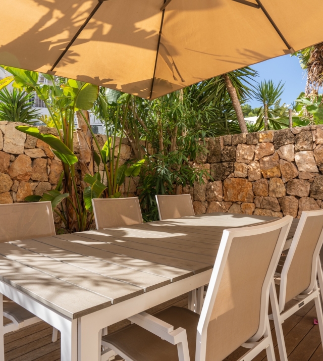 Resa Estates Ibiza sale ted koop Cala Tarida patio townhouse dining exterior.JPG